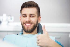 Young Man in Dentist Chair Getting Dental Health Checkup - Steven T. Cutbirth DDS Waco TX