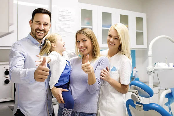 A family getting comprehensive family dentistry treatment at our dental office near you. Our general dentist office provides all general dentistry services.