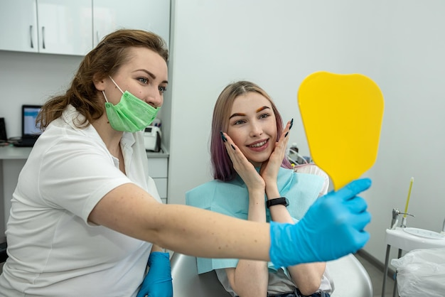 Patient looking in a mirror, getting ready for intravenous sedation during dental treatment.