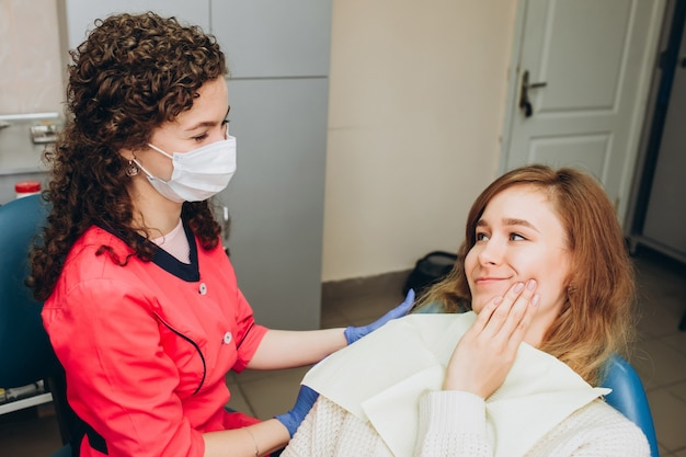 Dental professional administering intravenous sedation to a patient in a dental office.