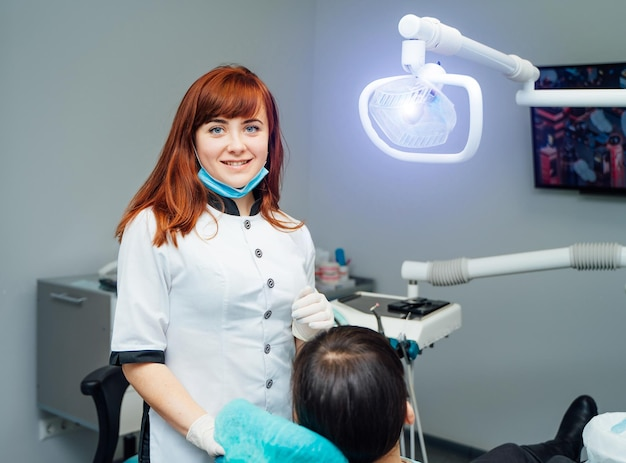 A platelet rich fibrin professional smiling, preparing a patient for PRF near you.