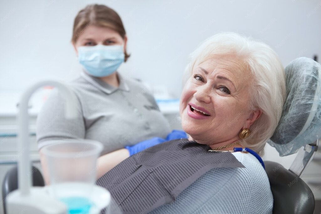 A patient in an All on 4 dental implants cost consultation at a clinic specializing in restorative dental treatments.