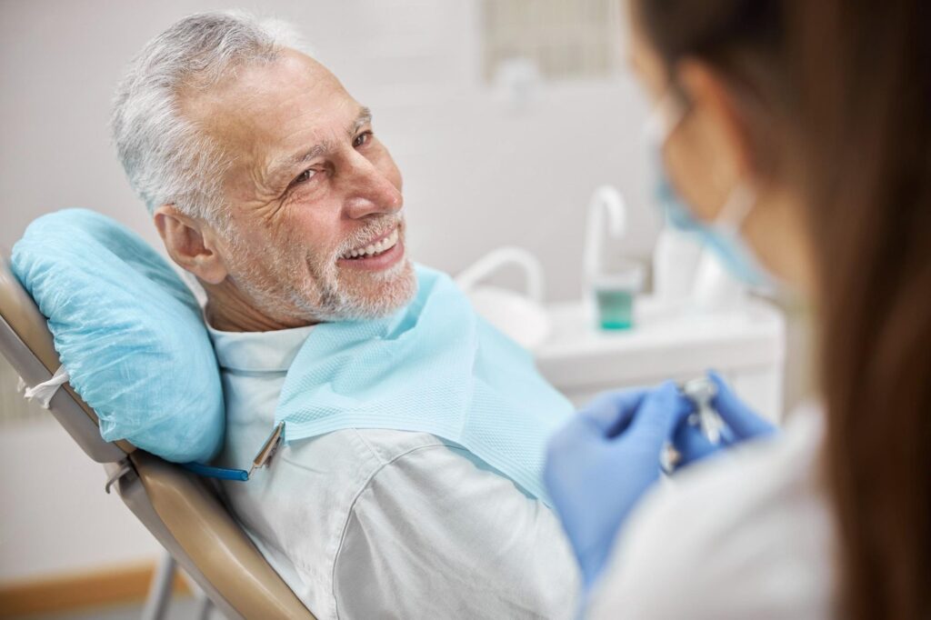 Patient and an All on 4 implant dental team at a clinic for All on 4 dental implants near you in Waco, TX.