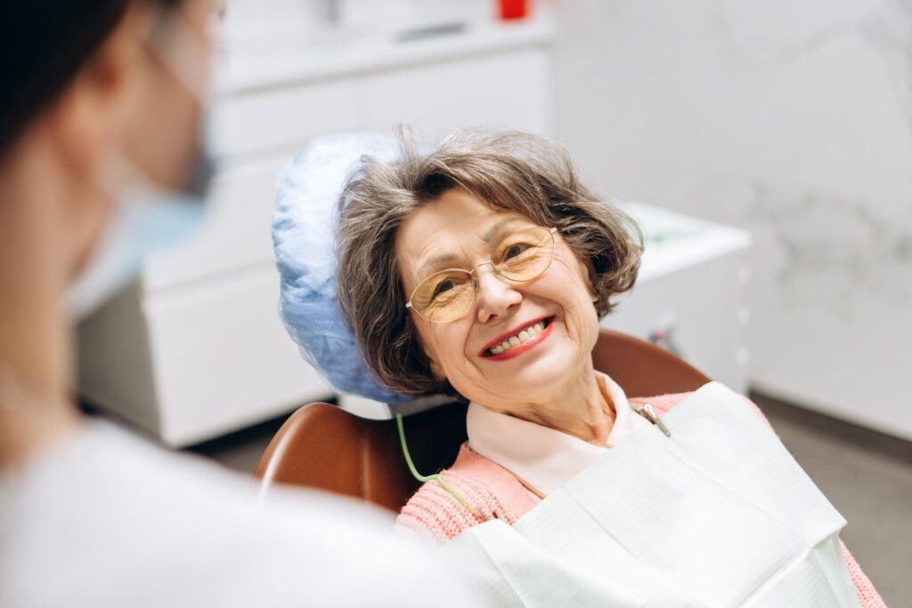 Dentist consulting with patient about tooth extraction costs and complex tooth extraction procedures.