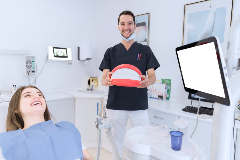Dentist consulting with a patient about a tooth bridge, tooth crown, and partial denture option. She is happy with the crown tooth option.