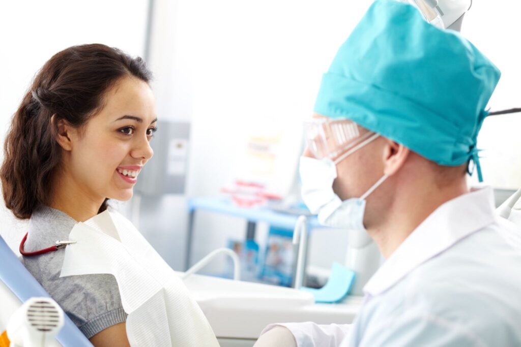 Dentist demonstrating aftercare steps following a tooth extraction near you.