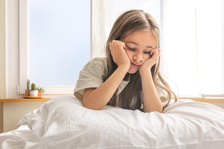 A young girl showing sleepy signs of sleep apnea and snoring. A sleep apnea test should be administered to discover sleep apnea and snoring.