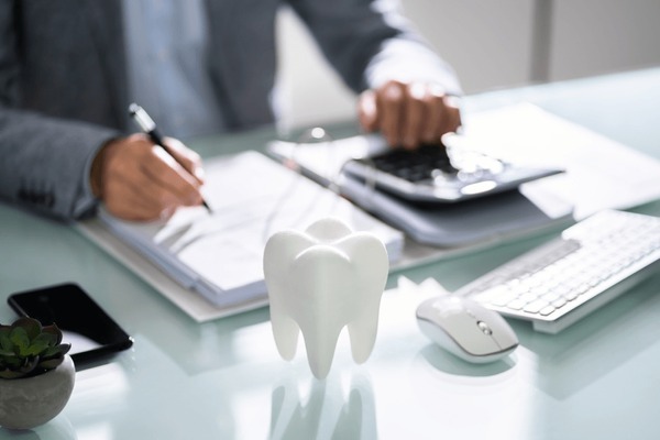 A dentist working with dental financing options such as CareCredit payment plans.